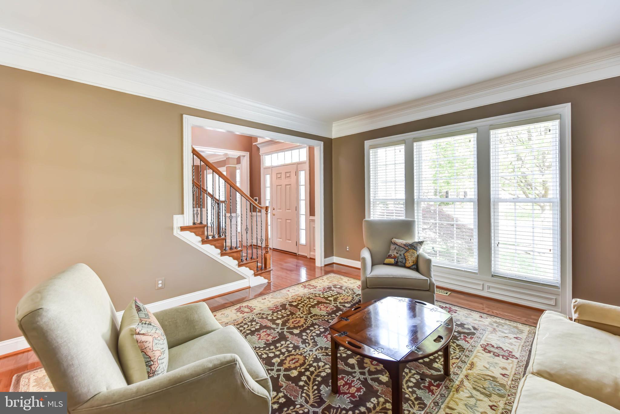 8244 Native Violet Drive Lorton, VA 22079 - Photo 29 of 68 a living room with furniture and a large window