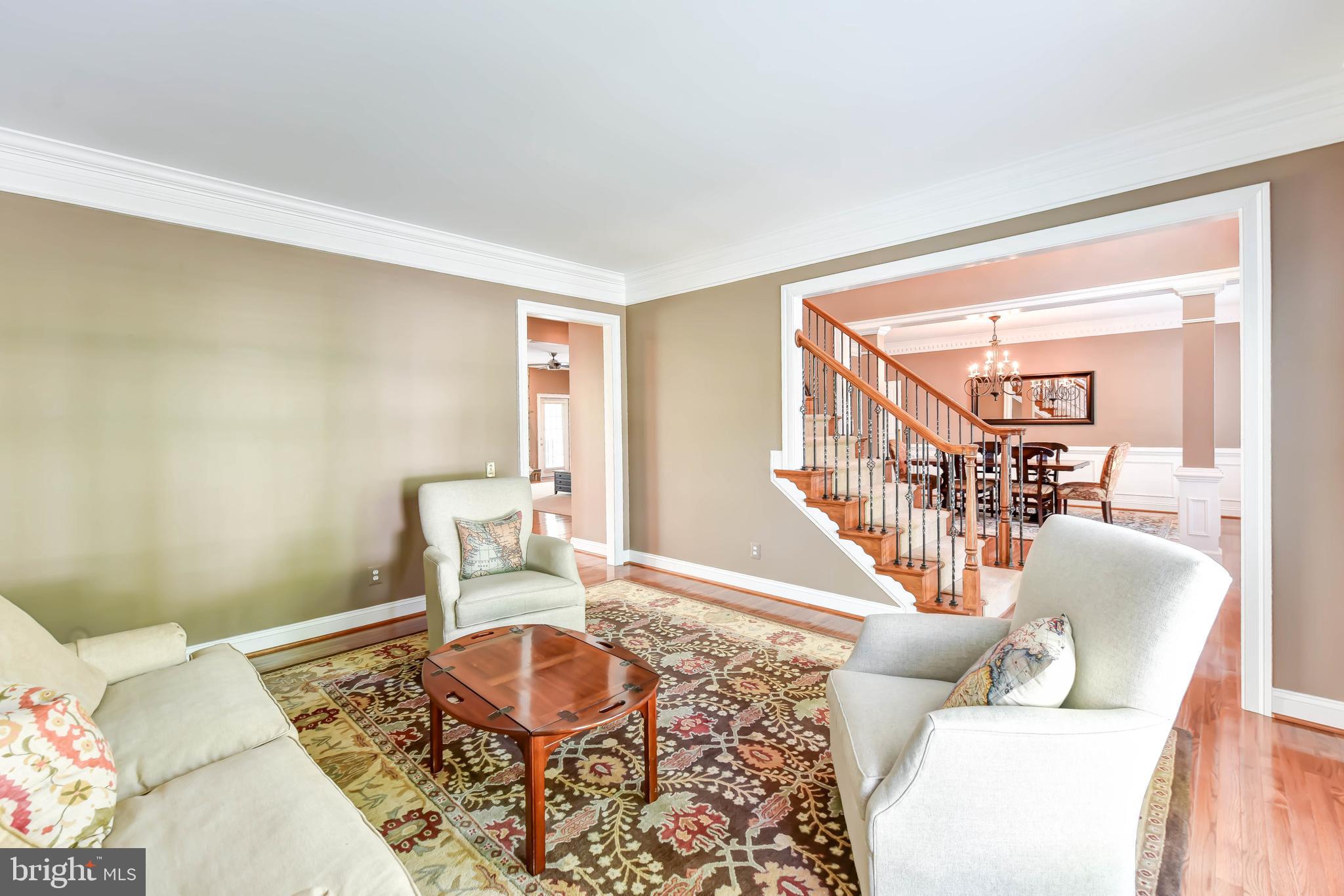 8244 Native Violet Drive Lorton, VA 22079 - Photo 30 of 68 a living room with furniture and a wooden floor