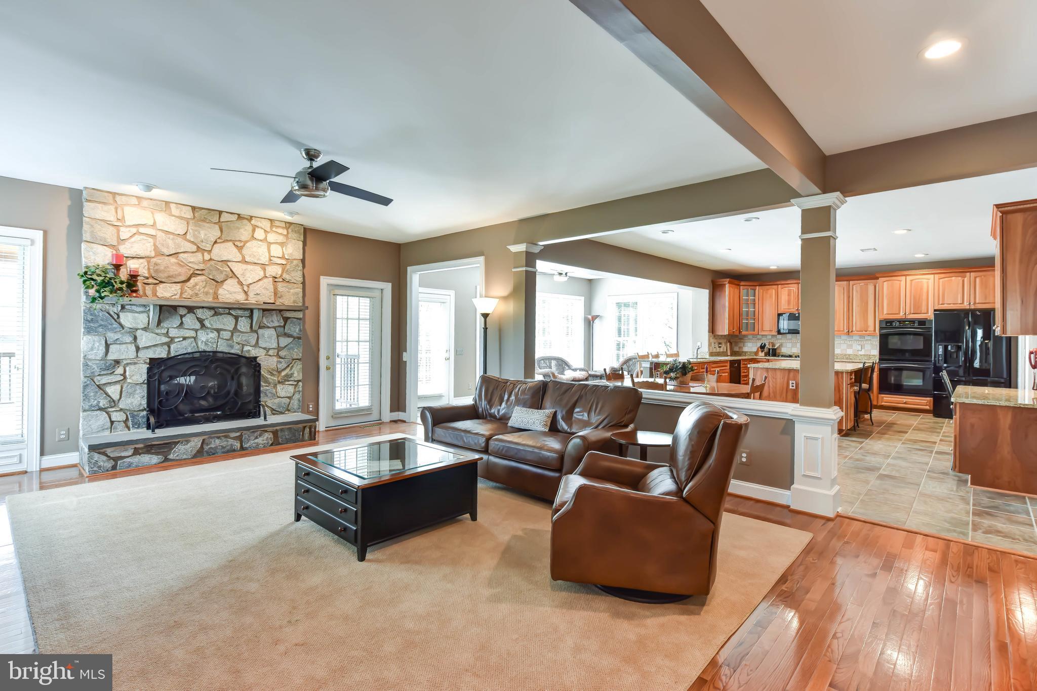 8244 Native Violet Drive Lorton, VA 22079 - Photo 5 of 68 a living room with furniture large window and a fireplace