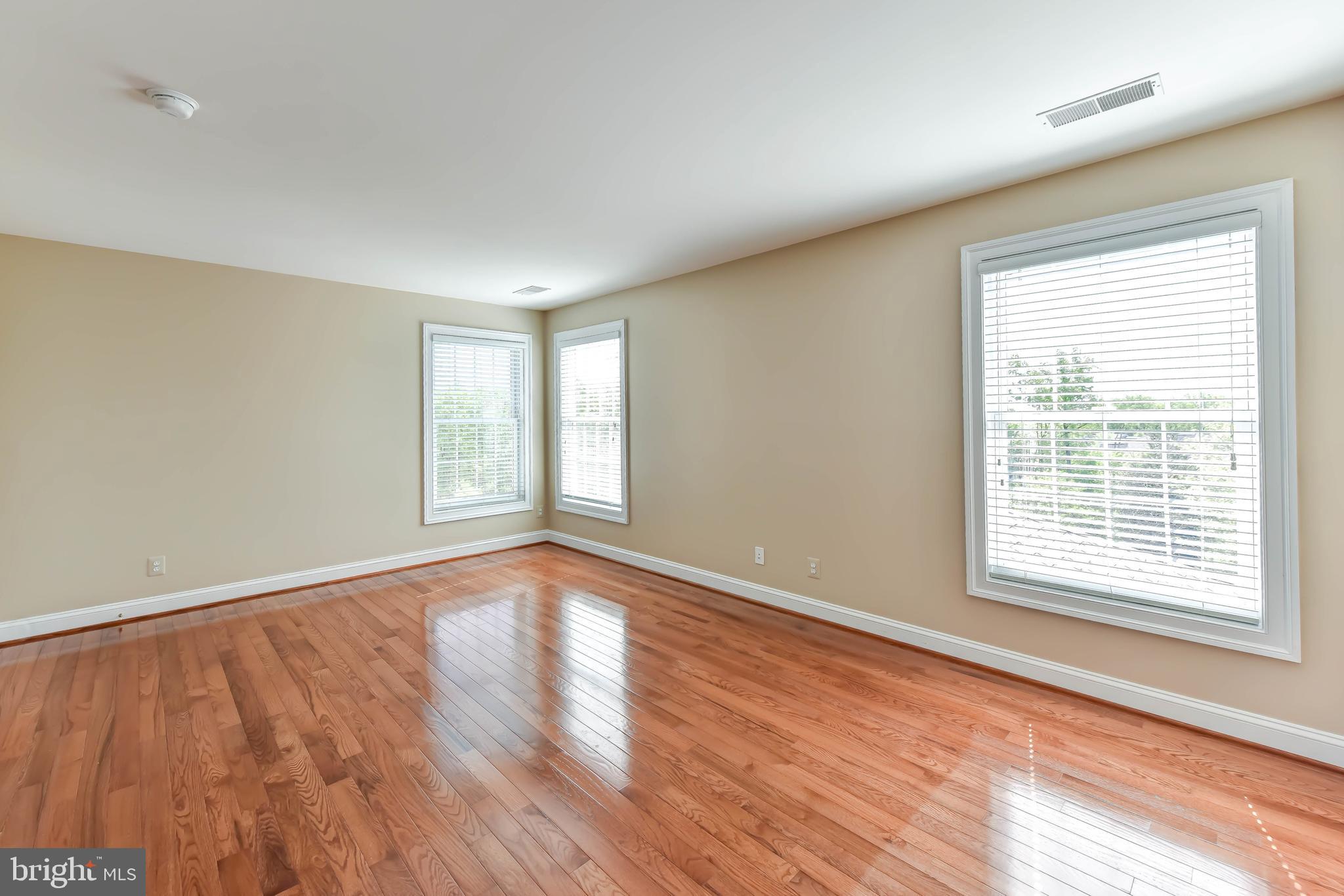 8244 Native Violet Drive Lorton, VA 22079 - Photo 40 of 68 a view of an empty room with wooden floor and a window