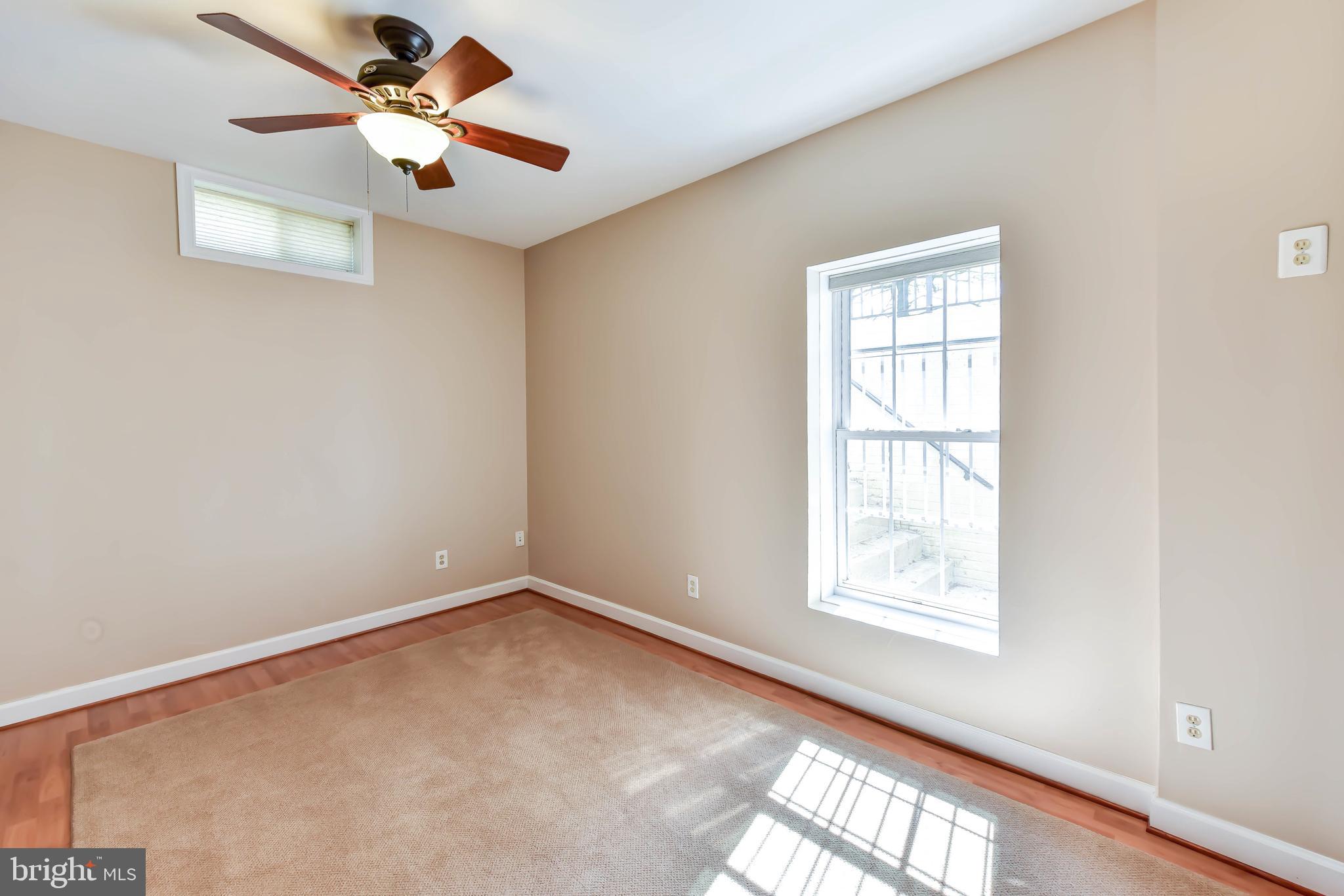 8244 Native Violet Drive Lorton, VA 22079 - Photo 48 of 68 an empty room with windows and fan