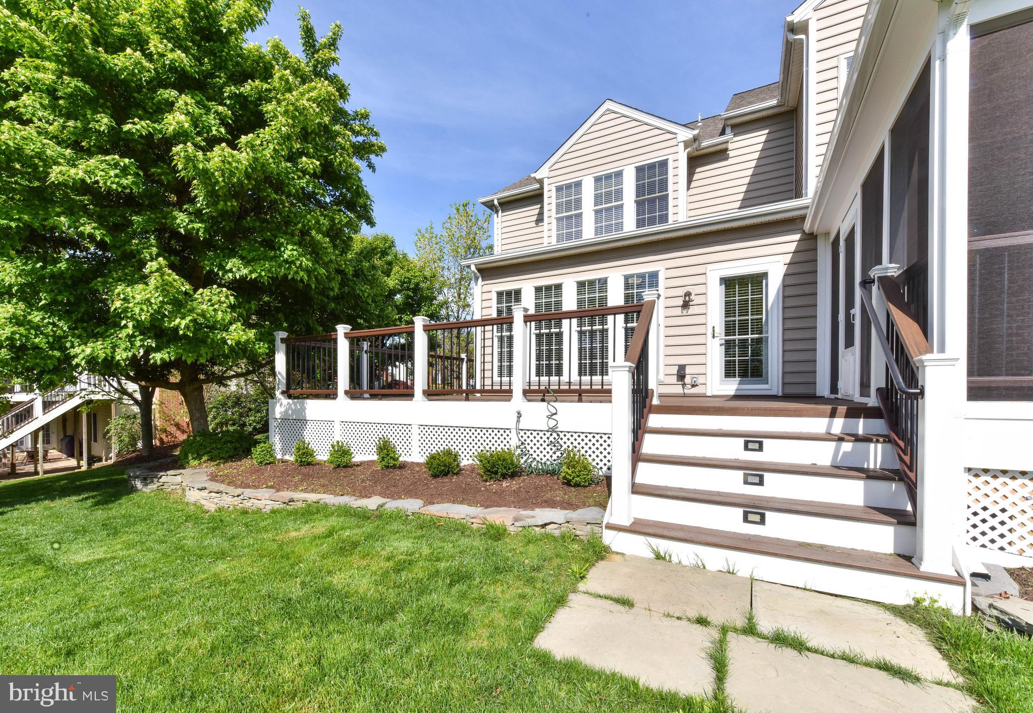 8244 Native Violet Drive Lorton, VA 22079 - Photo 56 of 68 a front view of a house with a yard