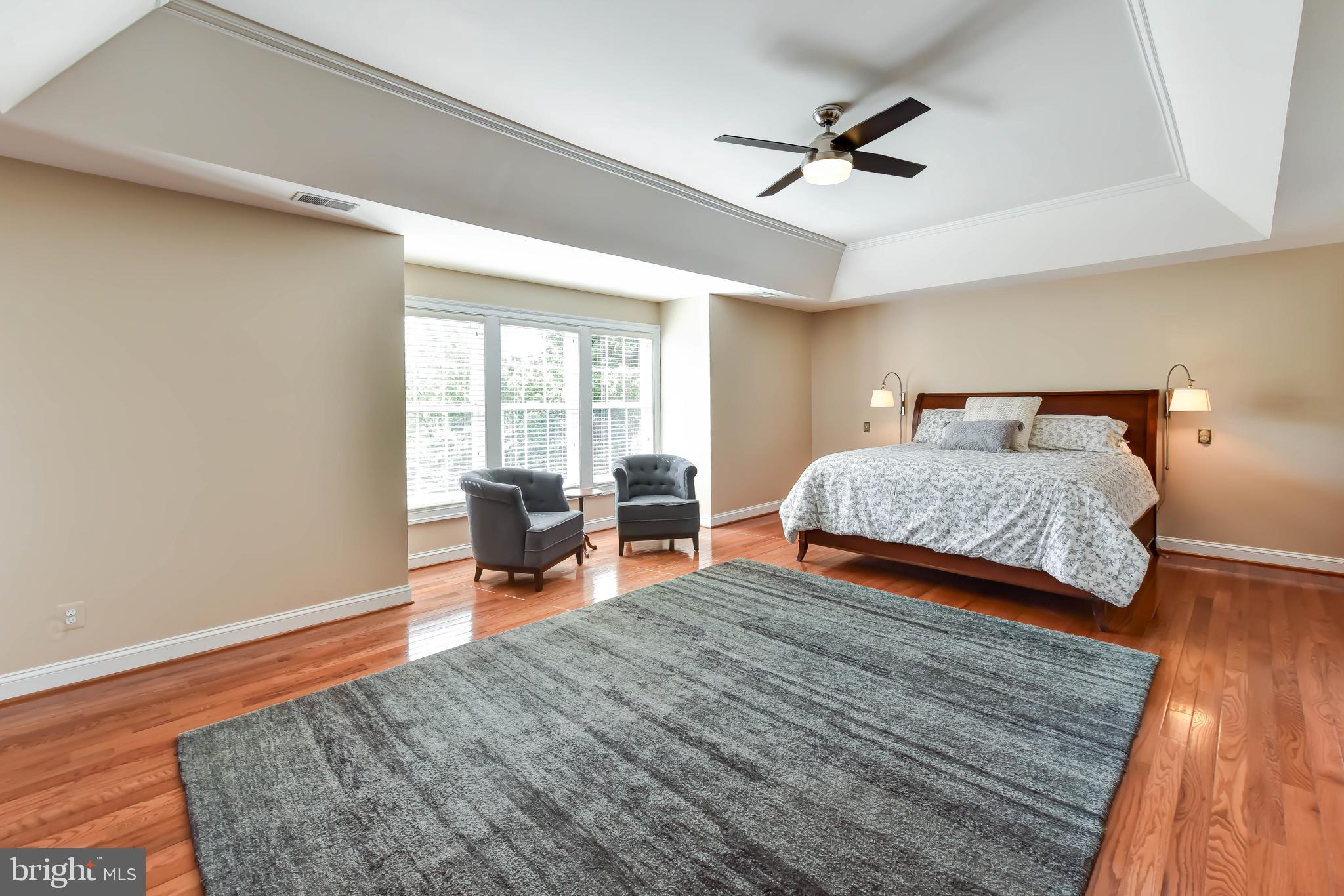 8244 Native Violet Drive Lorton, VA 22079 - Photo 7 of 68 a bedroom with furniture and a large window