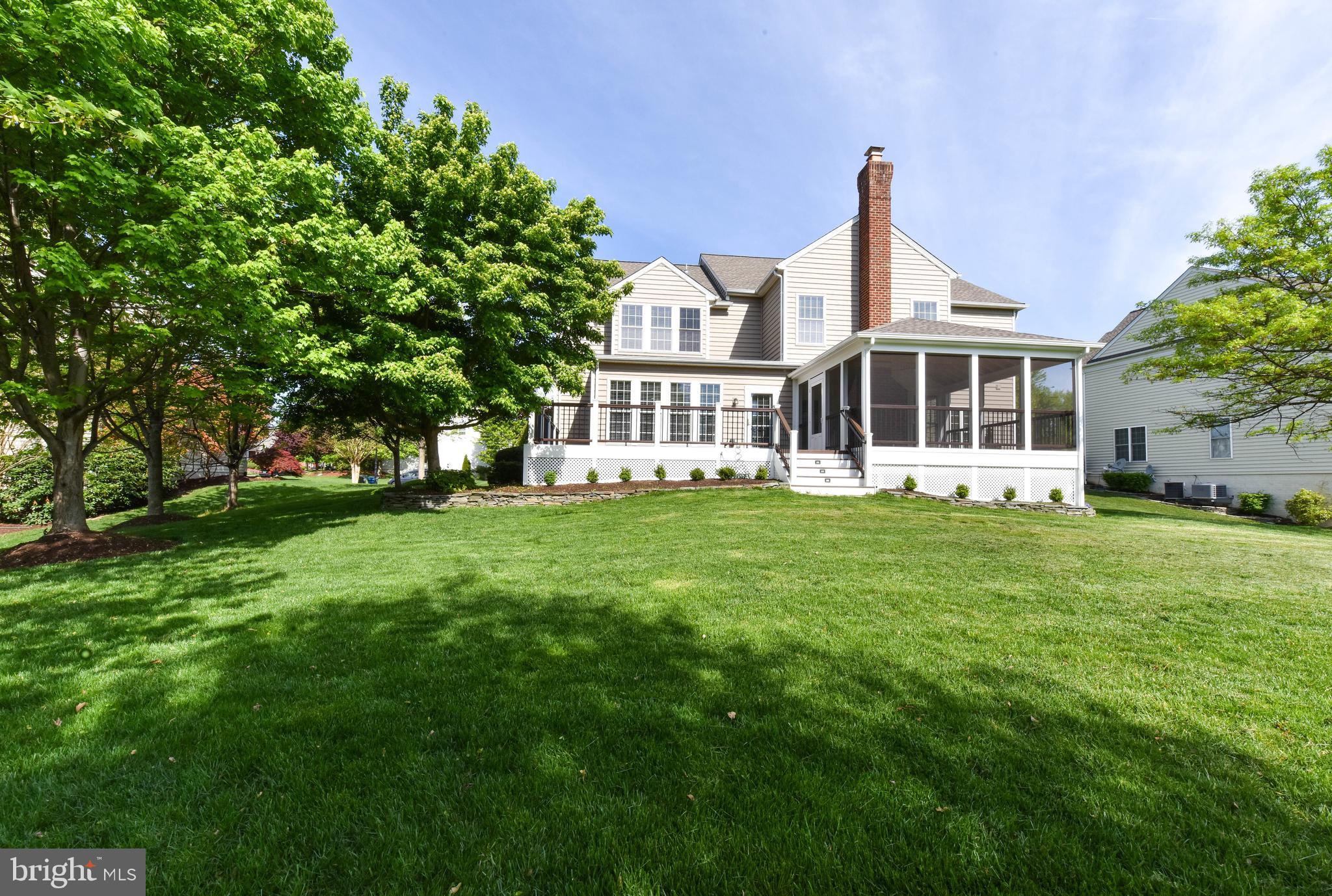 8244 Native Violet Drive Lorton, VA 22079 - Photo 61 of 68 a front view of a house with a yard