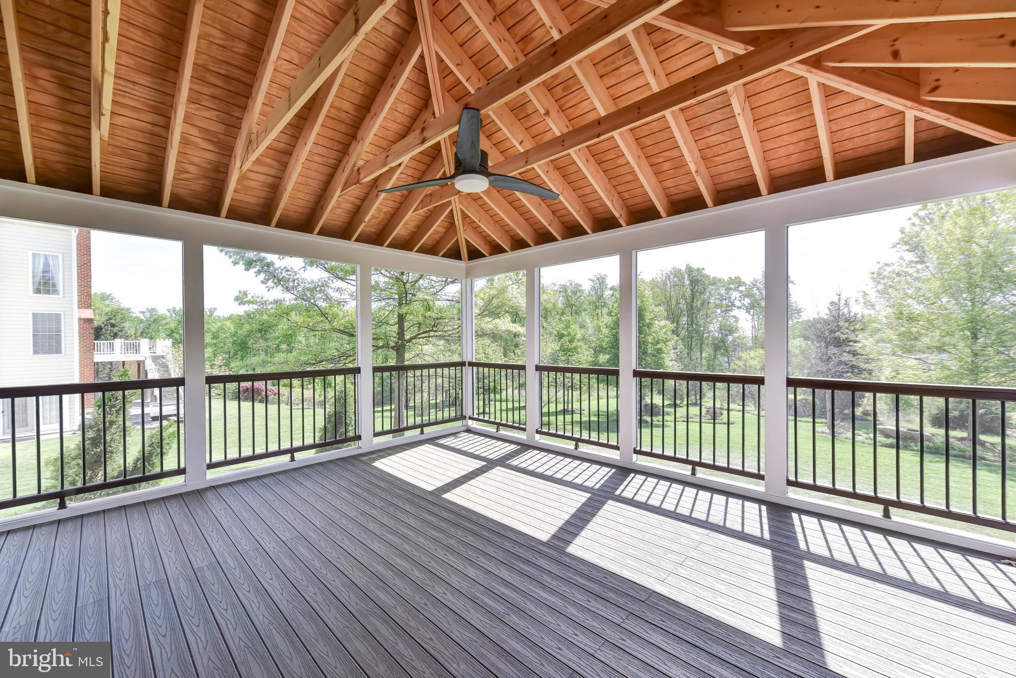 8244 Native Violet Drive Lorton, VA 22079 - Photo 10 of 68 a view of balcony with a floor to ceiling window with wooden floor