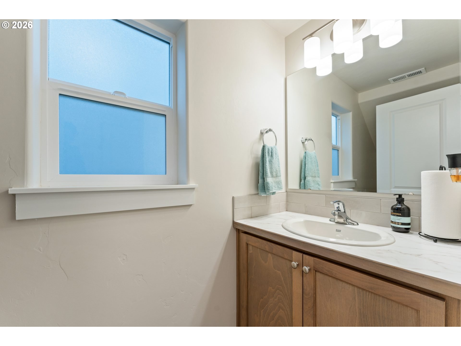 5177 Holly Street Springfield, OR 97478 - Photo 13 of 14 a bathroom with a sink vanity and a mirror