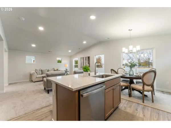 a kitchen with a table and chairs in it