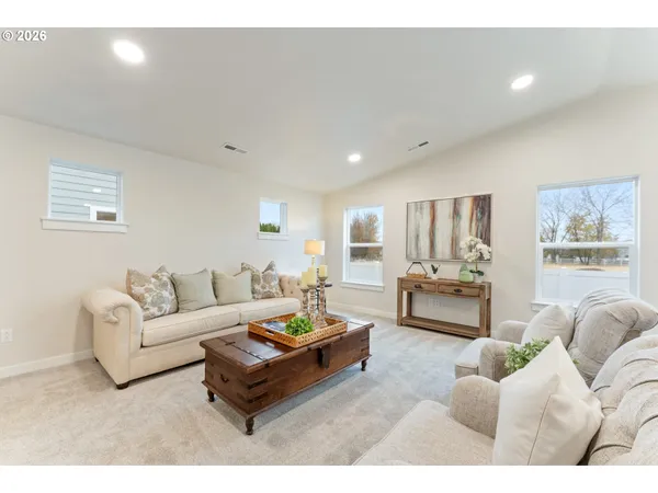 a living room with furniture and a table