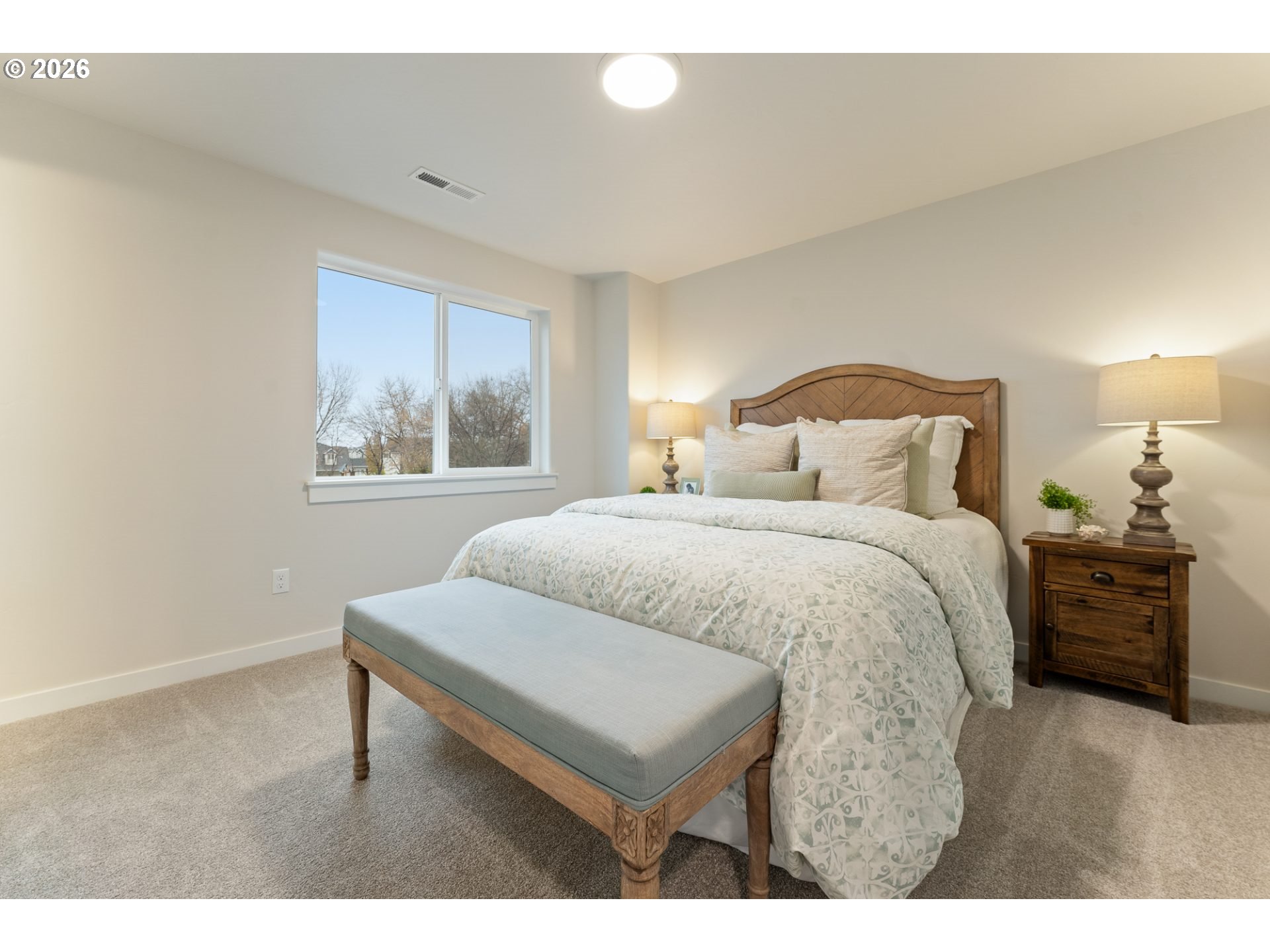 5177 Holly Street Springfield, OR 97478 - Photo 10 of 14 a bedroom with a bed and a night stand