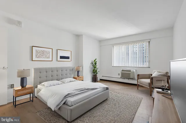 a bedroom with a bed and a couch