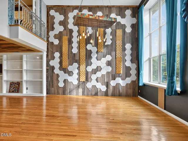 a view of room with window and wooden floor