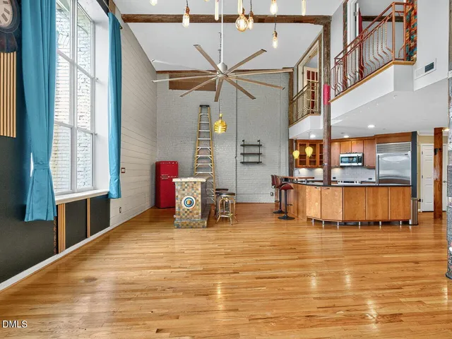 a view of a kitchen with a sink and cabinets