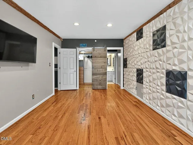 a bathroom with a shower and a mirror