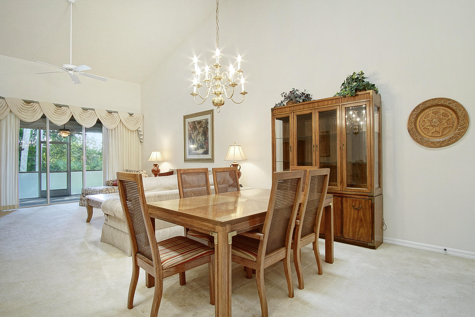 1639 Southwest Harbour Isles Circle, Unit 29 Port St. Lucie, FL 34986 - Photo 12 of 35 a view of a dining room with furniture window and wooden floor