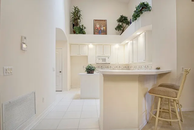a bathroom with a sink a mirror and a bathtub