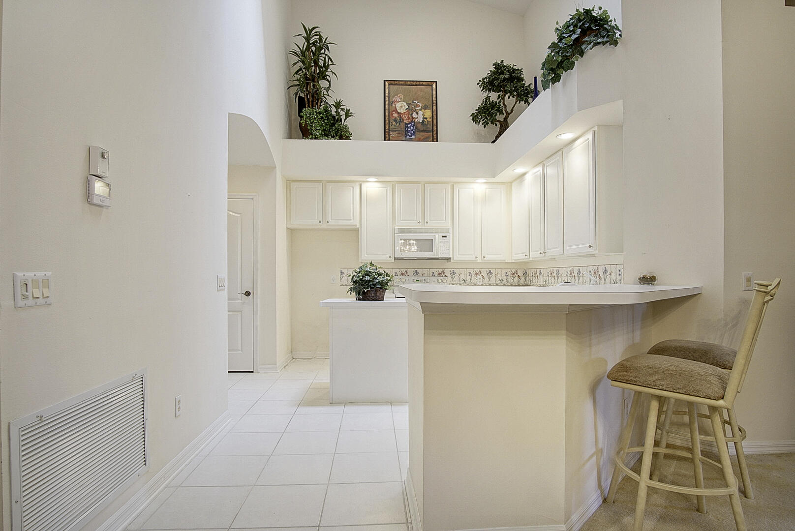 1639 Southwest Harbour Isles Circle, Unit 29 Port St. Lucie, FL 34986 - Photo 14 of 35 a bathroom with a sink a mirror and a bathtub
