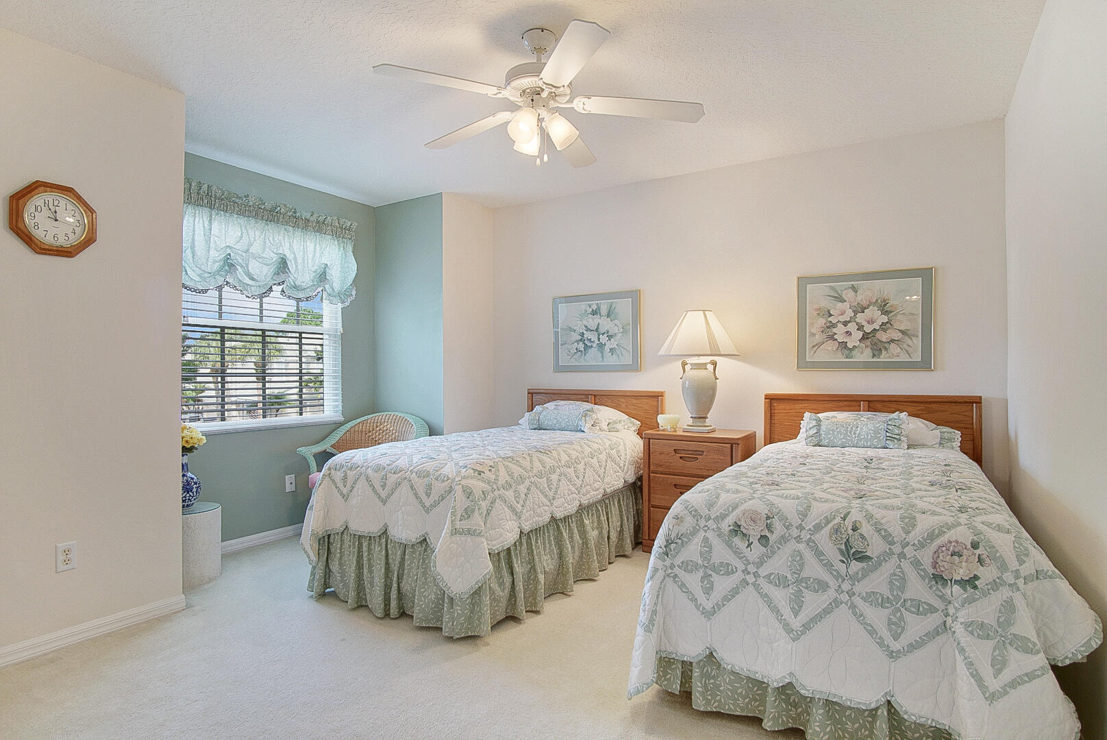 1639 Southwest Harbour Isles Circle, Unit 29 Port St. Lucie, FL 34986 - Photo 17 of 35 a bedroom with two beds and painting on the wall