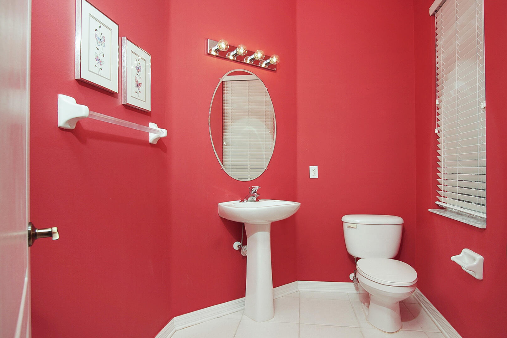 1639 Southwest Harbour Isles Circle, Unit 29 Port St. Lucie, FL 34986 - Photo 20 of 35 a bathroom with a toilet a sink and a mirror