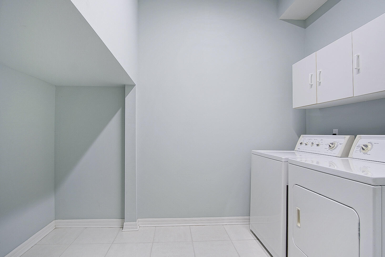 1639 Southwest Harbour Isles Circle, Unit 29 Port St. Lucie, FL 34986 - Photo 21 of 35 a utility room with dryer and washer