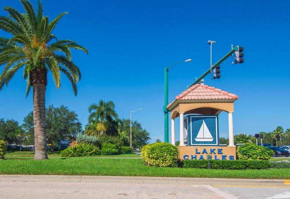 1639 Southwest Harbour Isles Circle, Unit 29 Port St. Lucie, FL 34986 - Photo 24 of 35 a front view of a house with garden