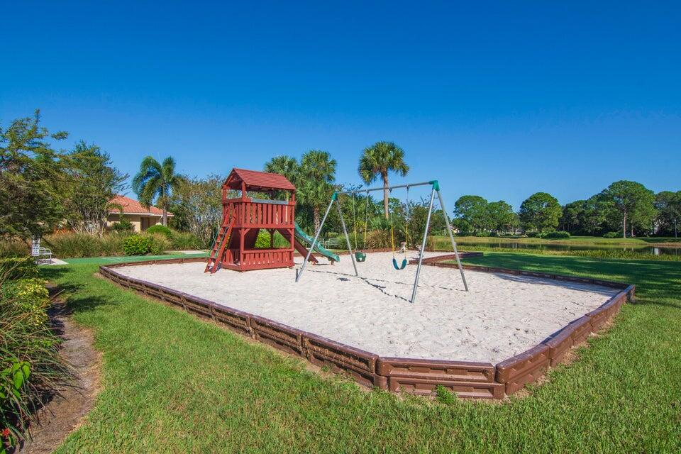 1639 Southwest Harbour Isles Circle, Unit 29 Port St. Lucie, FL 34986 - Photo 30 of 35 a park view with a fountain