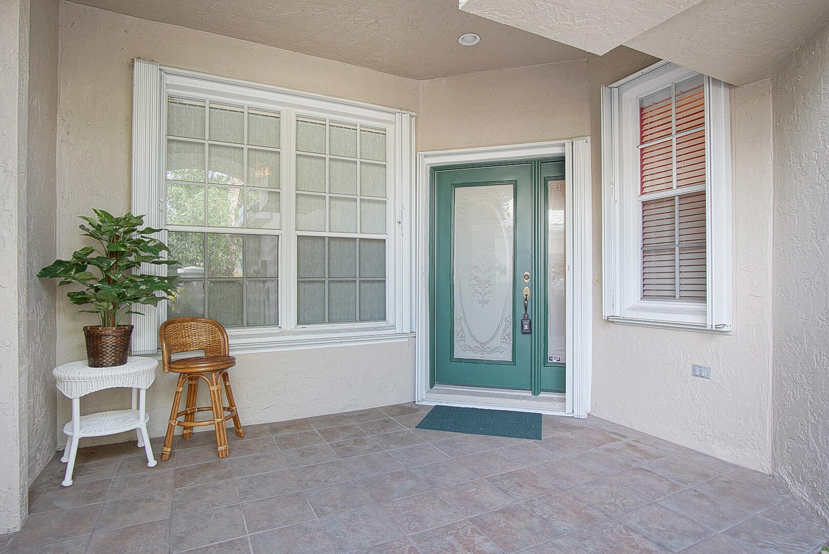 1639 Southwest Harbour Isles Circle, Unit 29 Port St. Lucie, FL 34986 - Photo 3 of 35 a workspace with furniture and a window