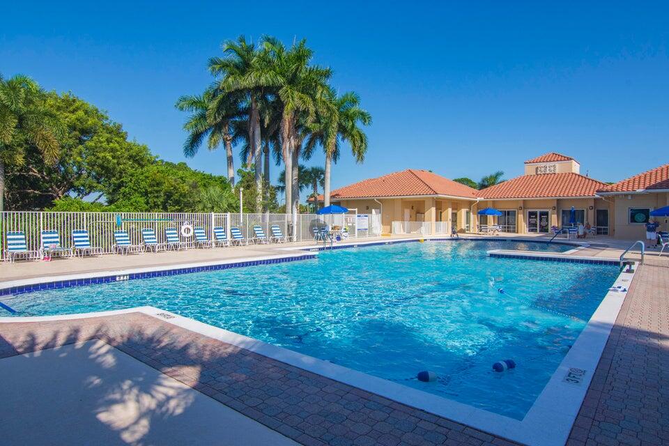 1639 Southwest Harbour Isles Circle, Unit 29 Port St. Lucie, FL 34986 - Photo 31 of 35 a view of a house with a yard