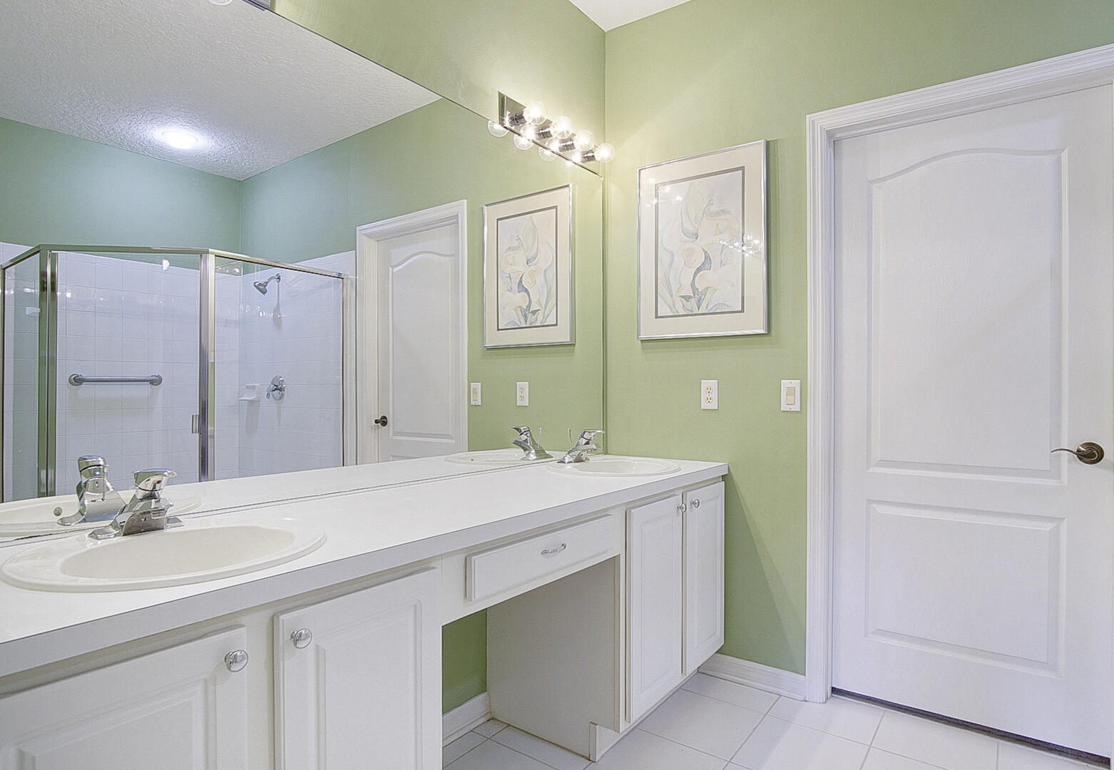 1639 Southwest Harbour Isles Circle, Unit 29 Port St. Lucie, FL 34986 - Photo 7 of 35 a bathroom with a sink double vanity and a mirror