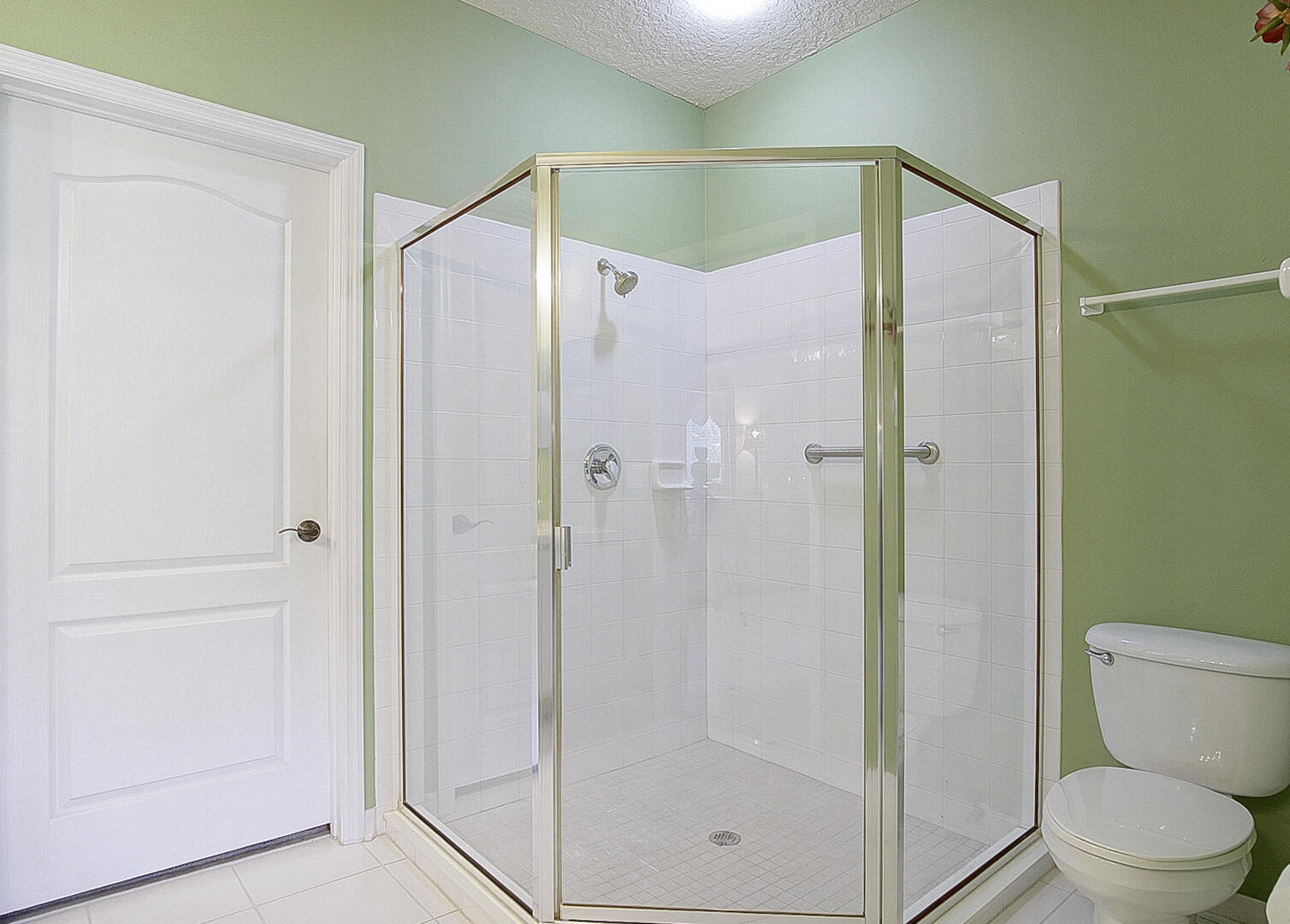 1639 Southwest Harbour Isles Circle, Unit 29 Port St. Lucie, FL 34986 - Photo 8 of 35 a bathroom that has a glass shower door