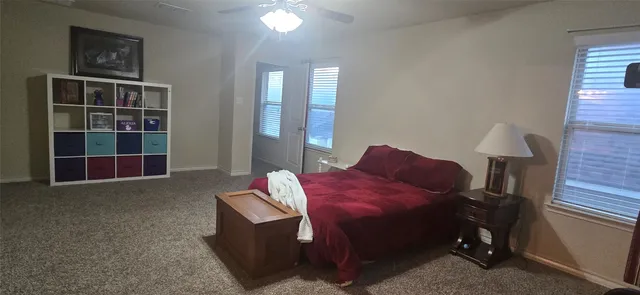 a bed room with a bed and a window