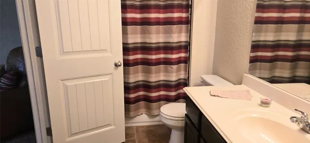 a bathroom with a sink and toilet