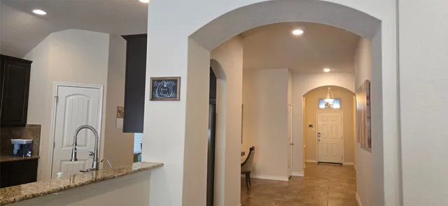 a view of a living room with a fireplace