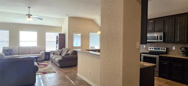 a living room with furniture and a flat screen tv
