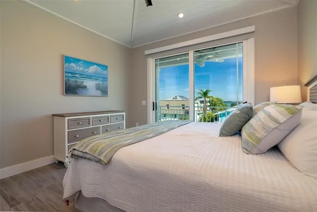 a bathroom with a granite countertop sink a mirror and shower