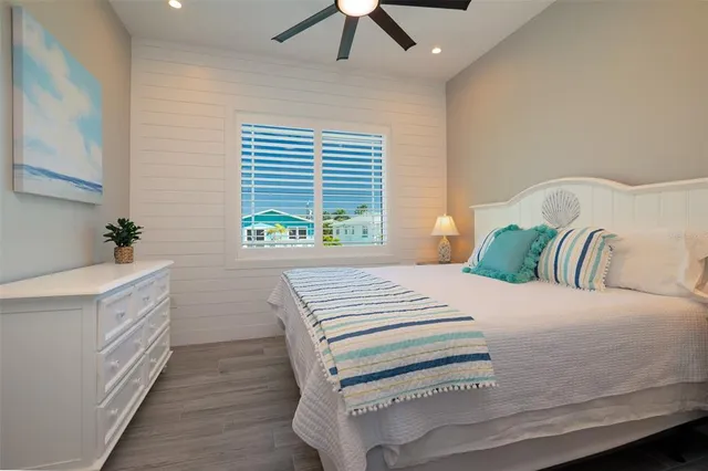 a bathroom with a toilet sink vanity and mirror