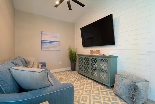 a view of a house with backyard porch and sitting area