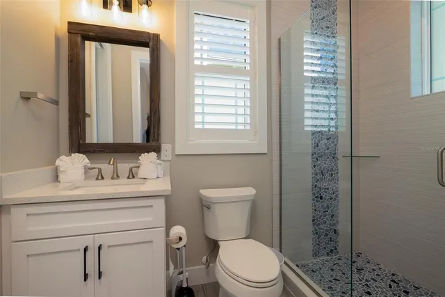 a outdoor sitting area with furniture and a yard