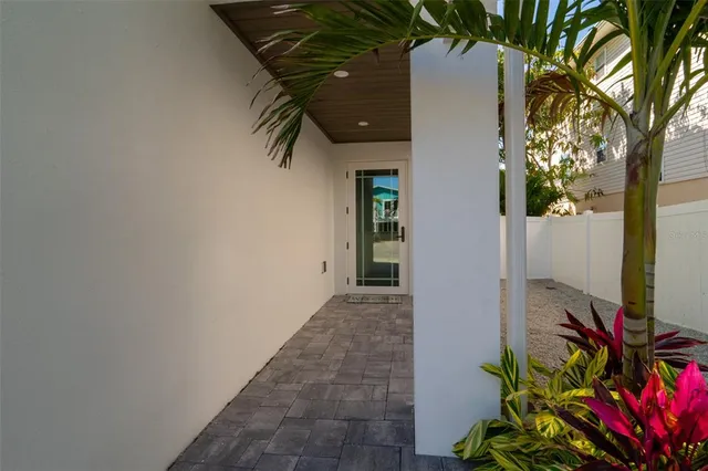 a living room with furniture a flat screen tv and a large window