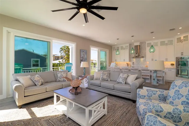 a large white kitchen with a large window