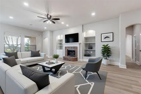 a living room with furniture fireplace and a flat screen tv