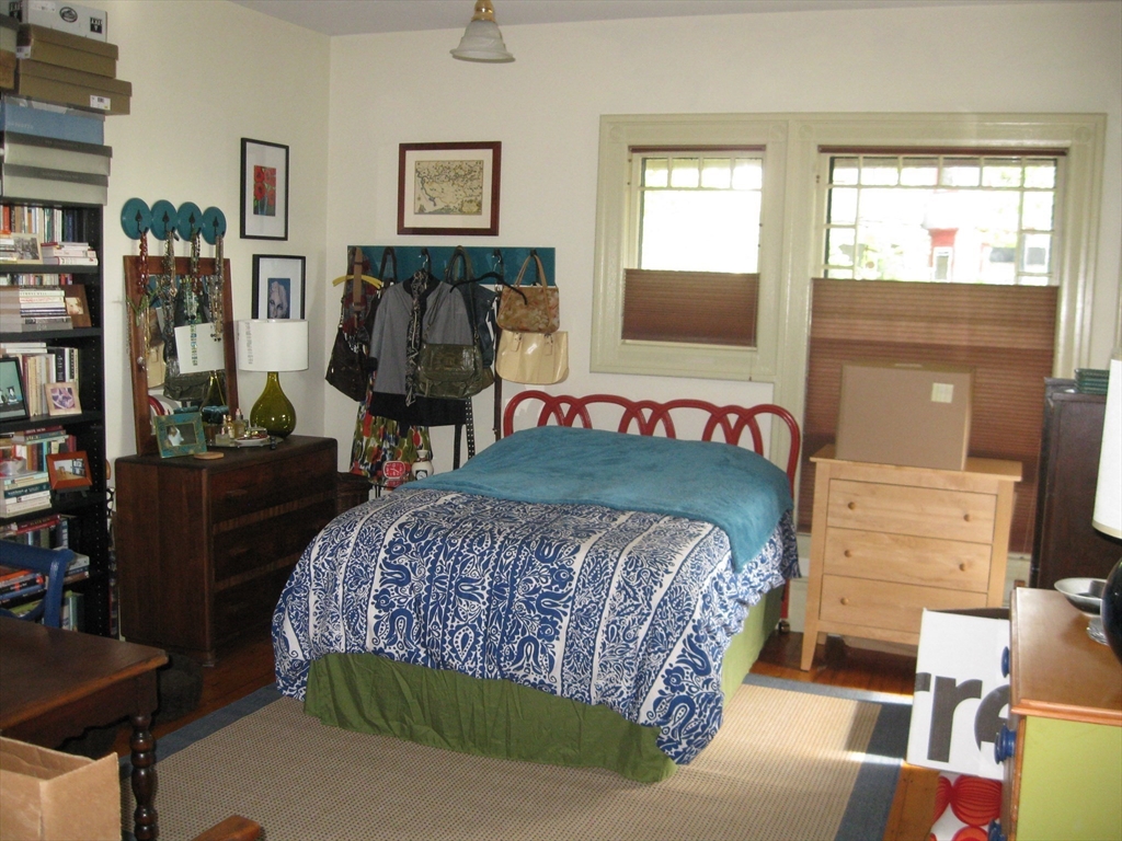 123 Cushing Avenue, Unit 1 Boston, MA 02125 - Photo 7 of 16 a bedroom with a bed and a window