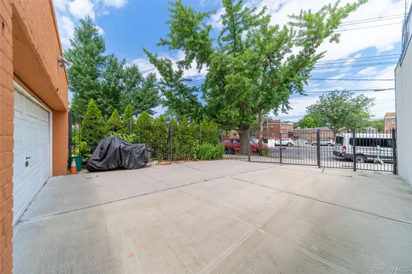 a view of backyard with outdoor seating and plants