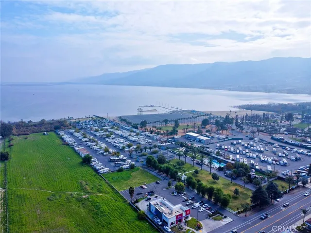 a front view of a house with a garden and parking space