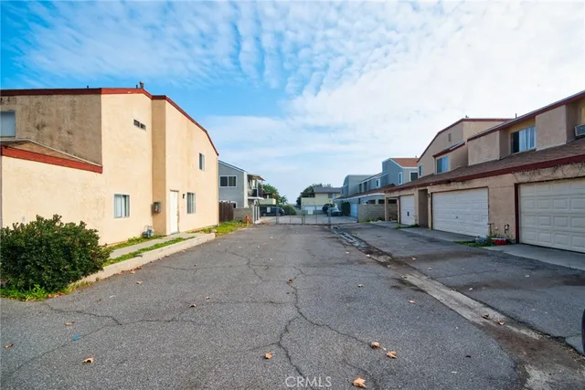 a bathroom with a granite countertop sink and a toilet