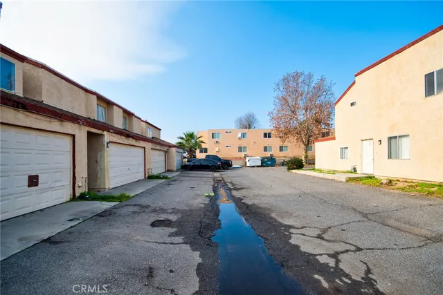 a view of a kitchen with wooden floor and a sink