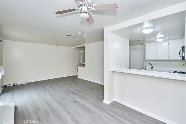 a house that has a tree in front of the house