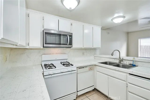 a living room with furniture and a gate