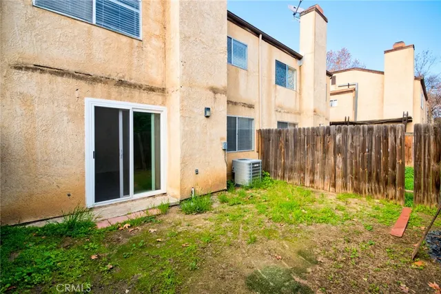 wooden floor in an empty room with a fireplace