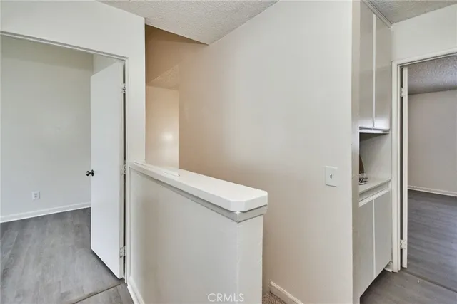 a room with wooden floor and a window