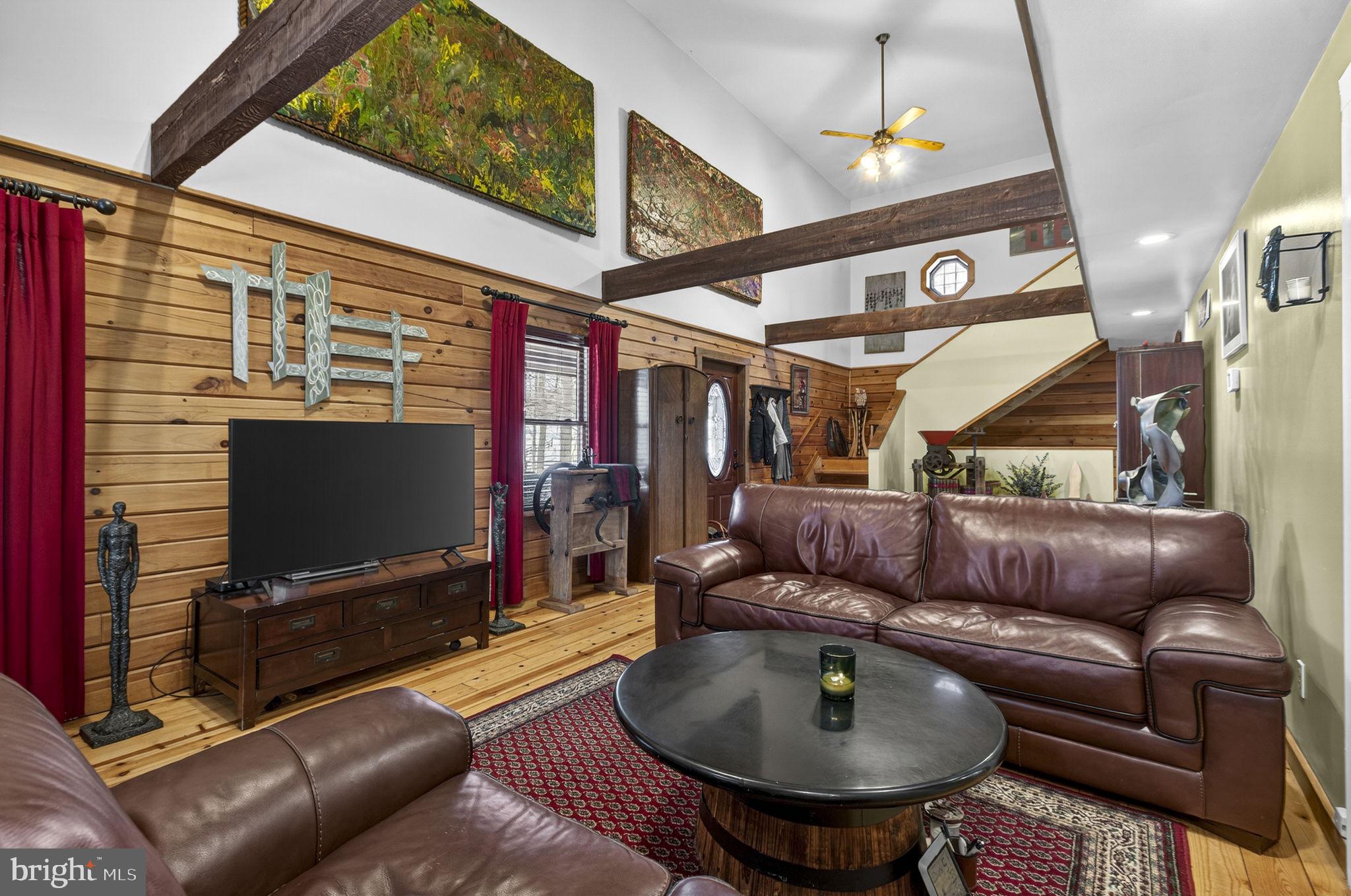 10418 Cliff Mills Road Marshall, VA 20115 - Photo 23 of 93 a living room with furniture and a flat screen tv